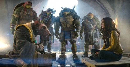 Left to right: Raphael, Splinter, Donatello, Leonardo, Michelangelo, and Megan Fox as April O'Neil in TEENAGE MUTANT NINJA TURTLES, from Paramount Pictures and Nickelodeon Movies.